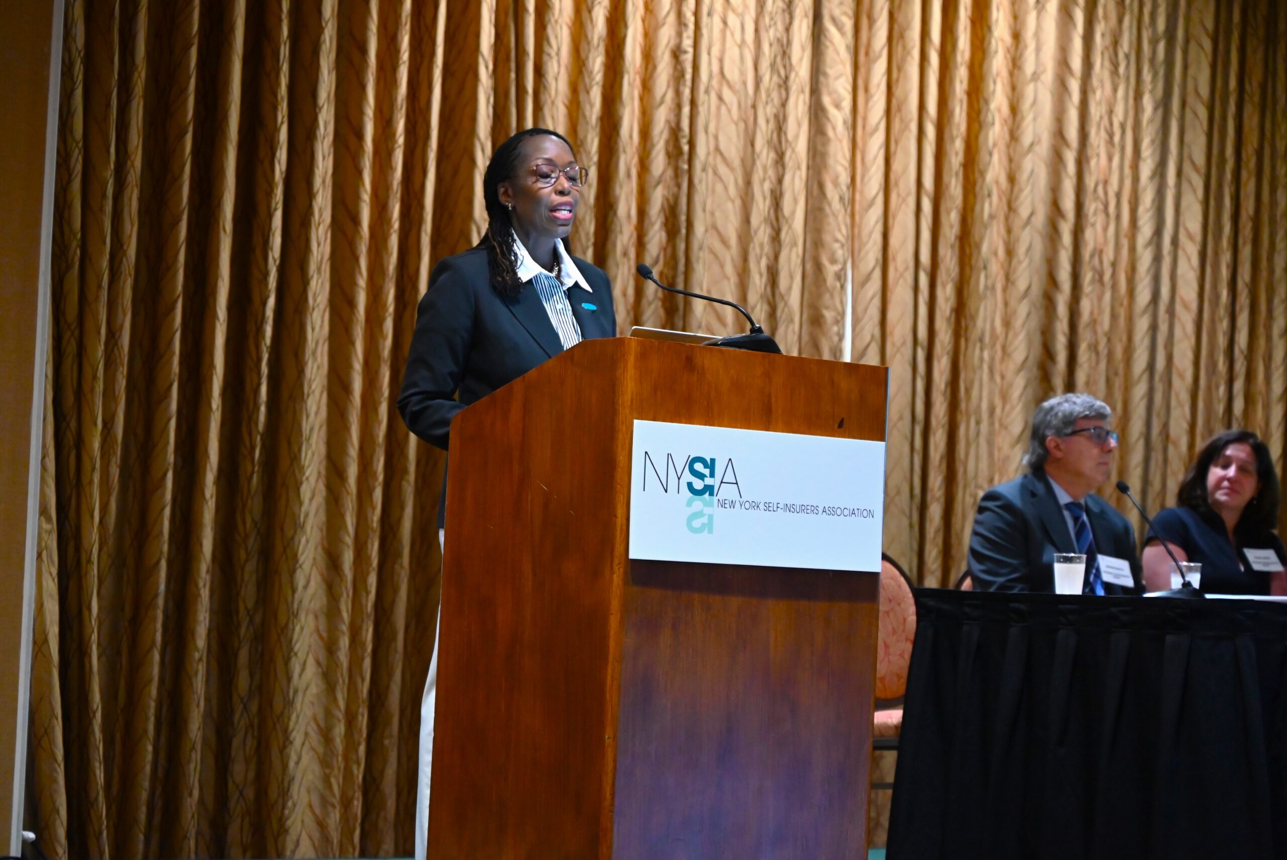 WCB Chair Freida Foster addresses attendees